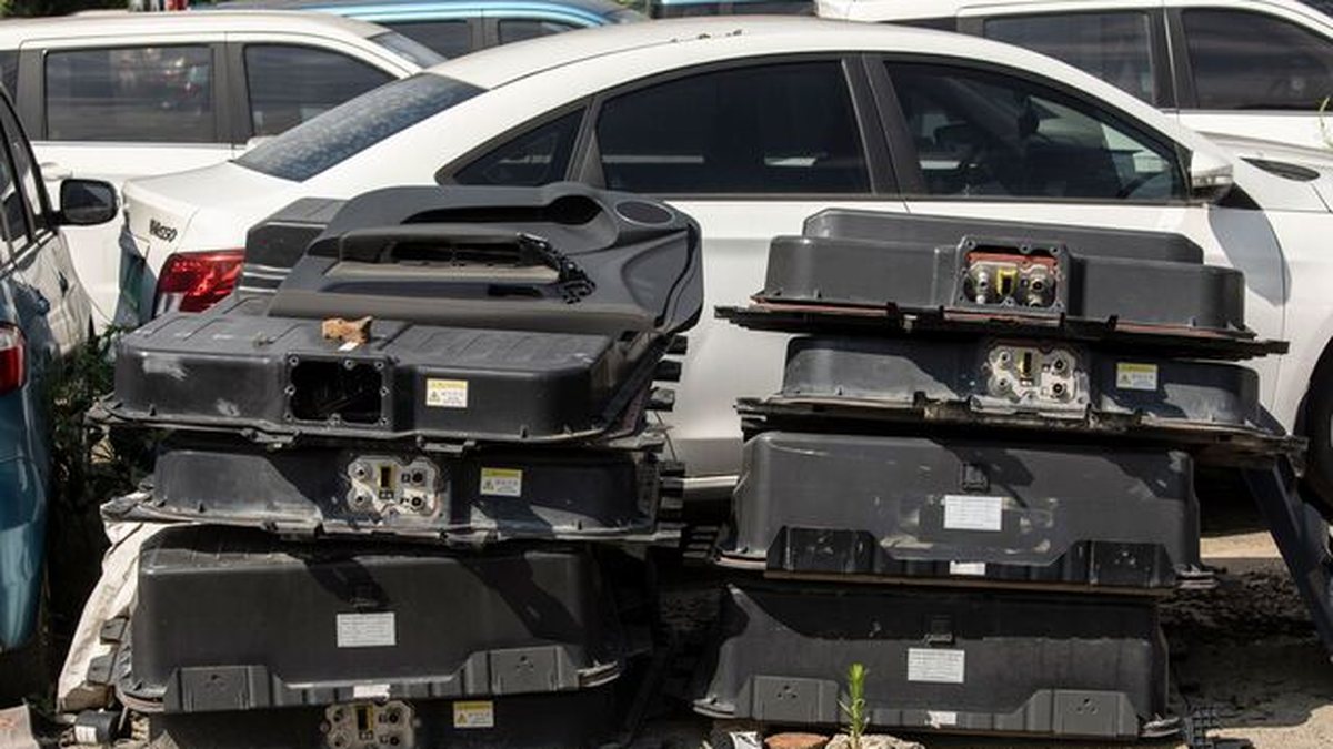 Retired EV battery packs stacked ready for testing and reuse